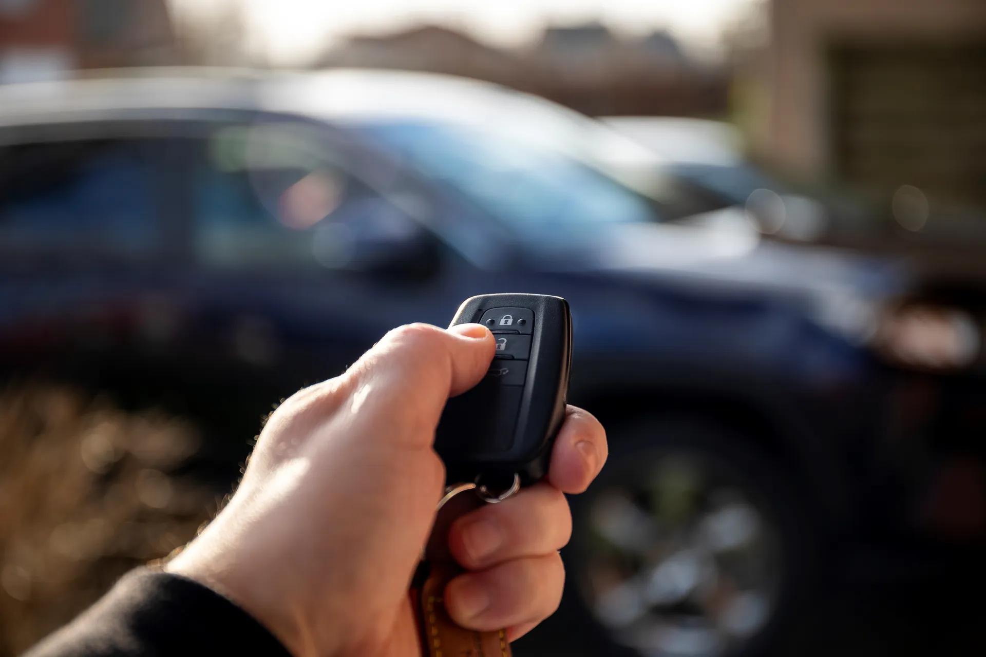 press the remote key fob to unlock the car door