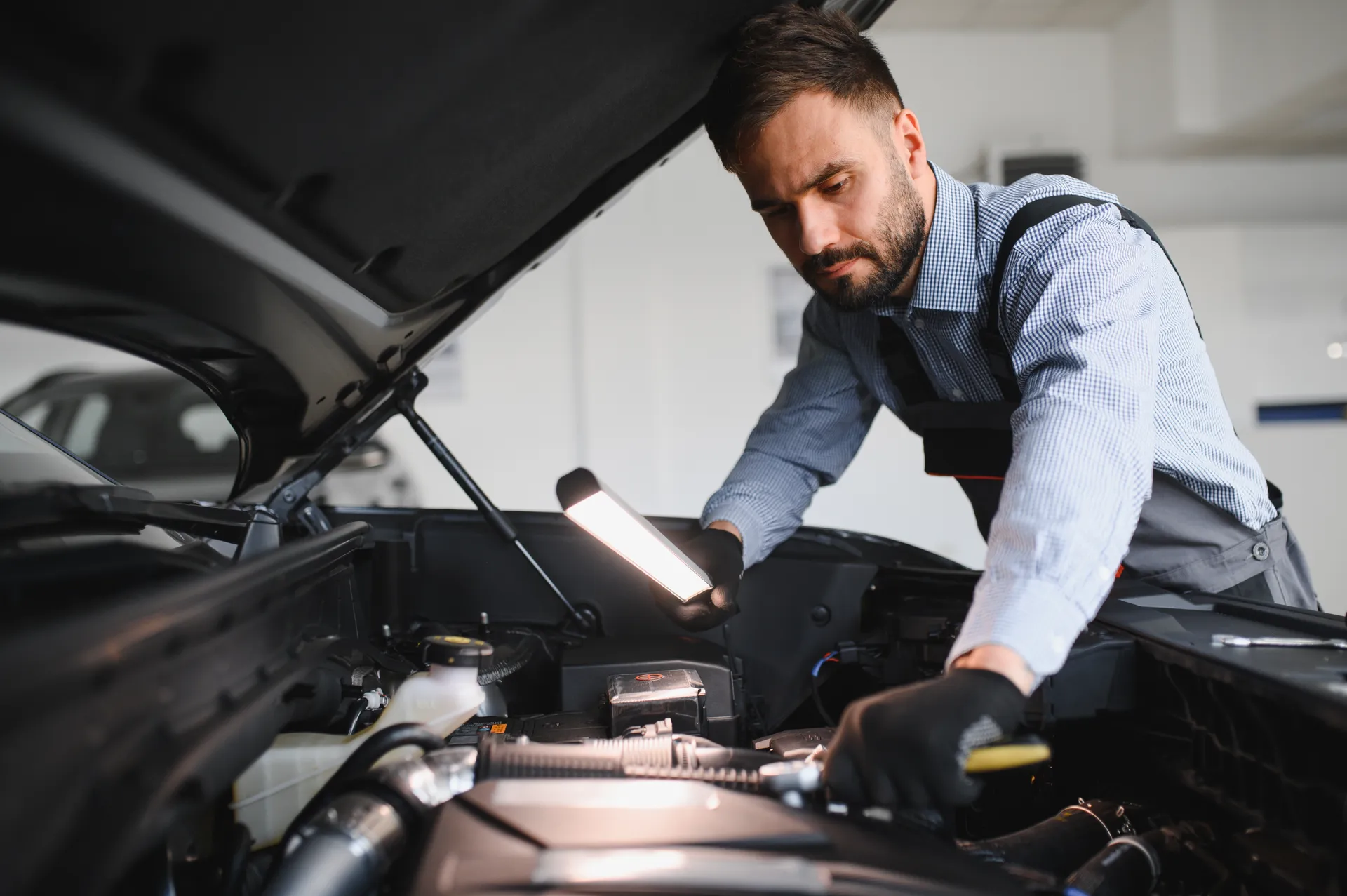 a mechanic is troubleshooting the issue