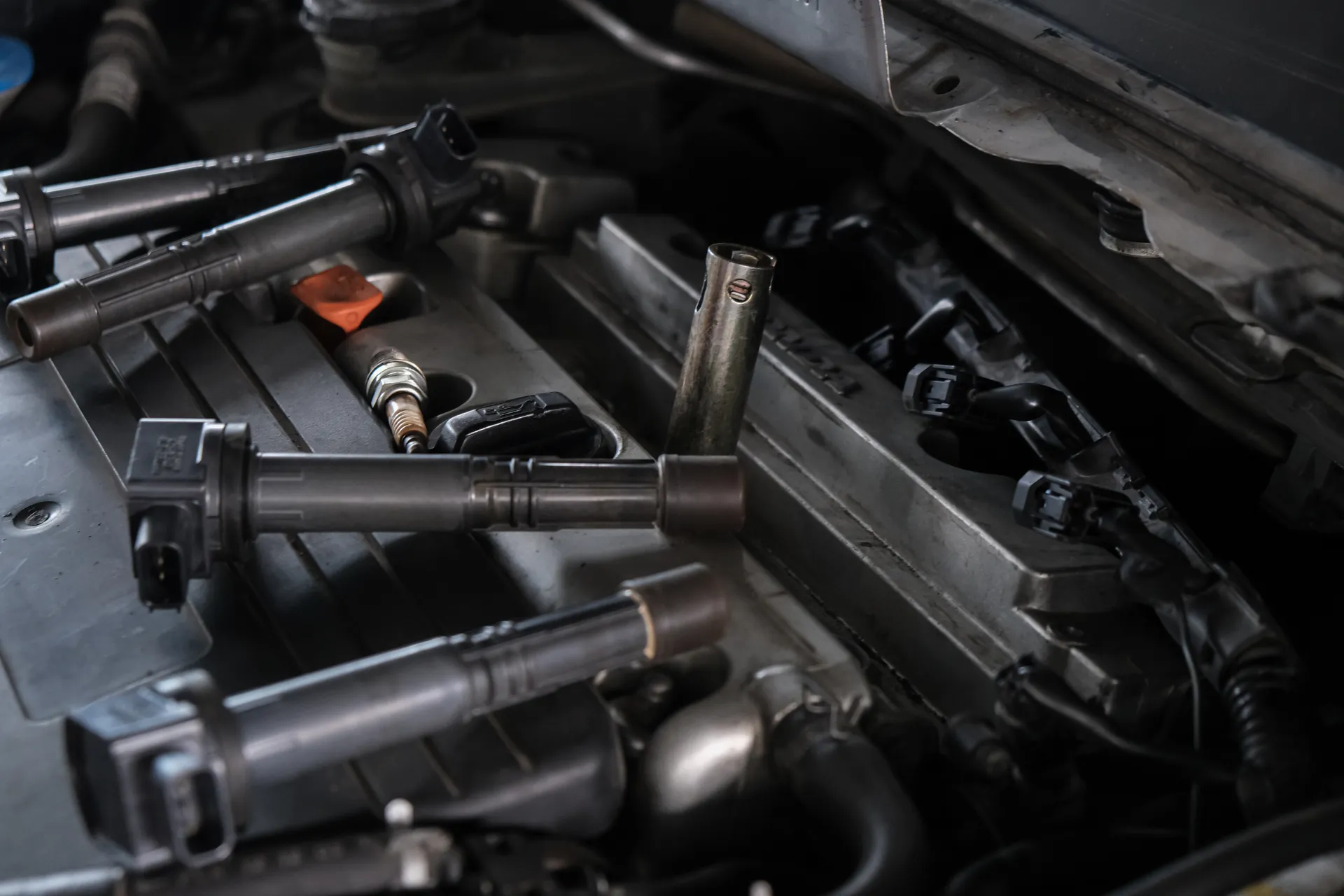 Ignition coils and spark plug removed during a cylinder misfire diagnosis