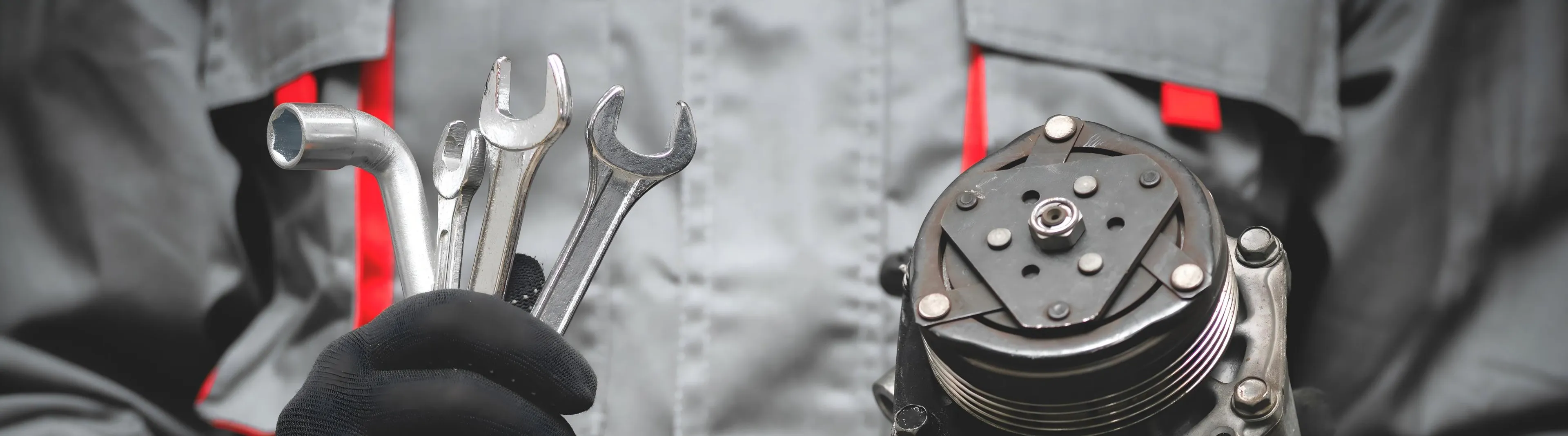 removing the AC compressor during a DIY car repair