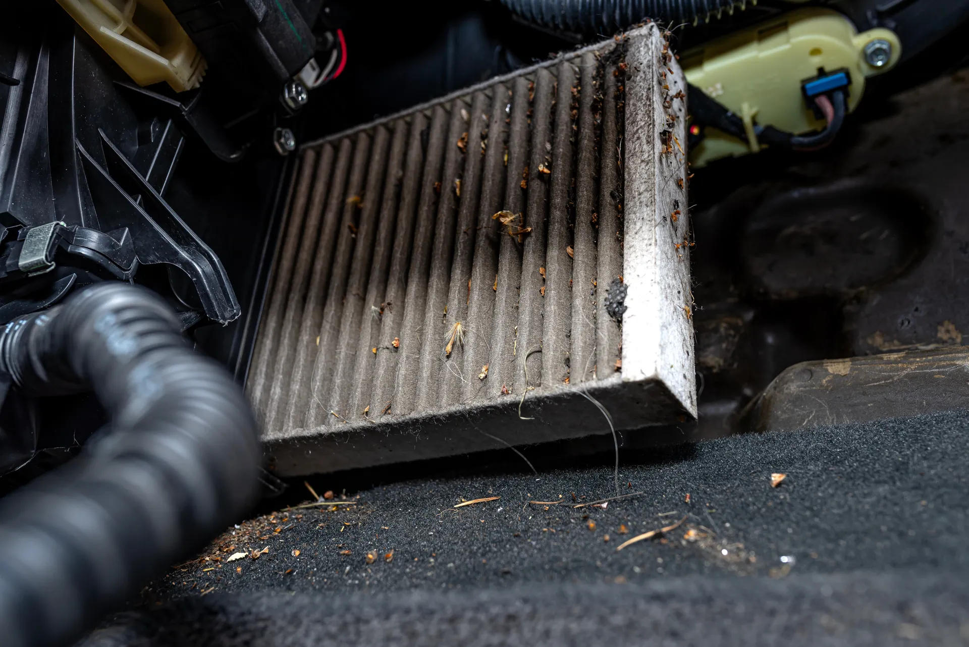 a dirty air filter near the glove box