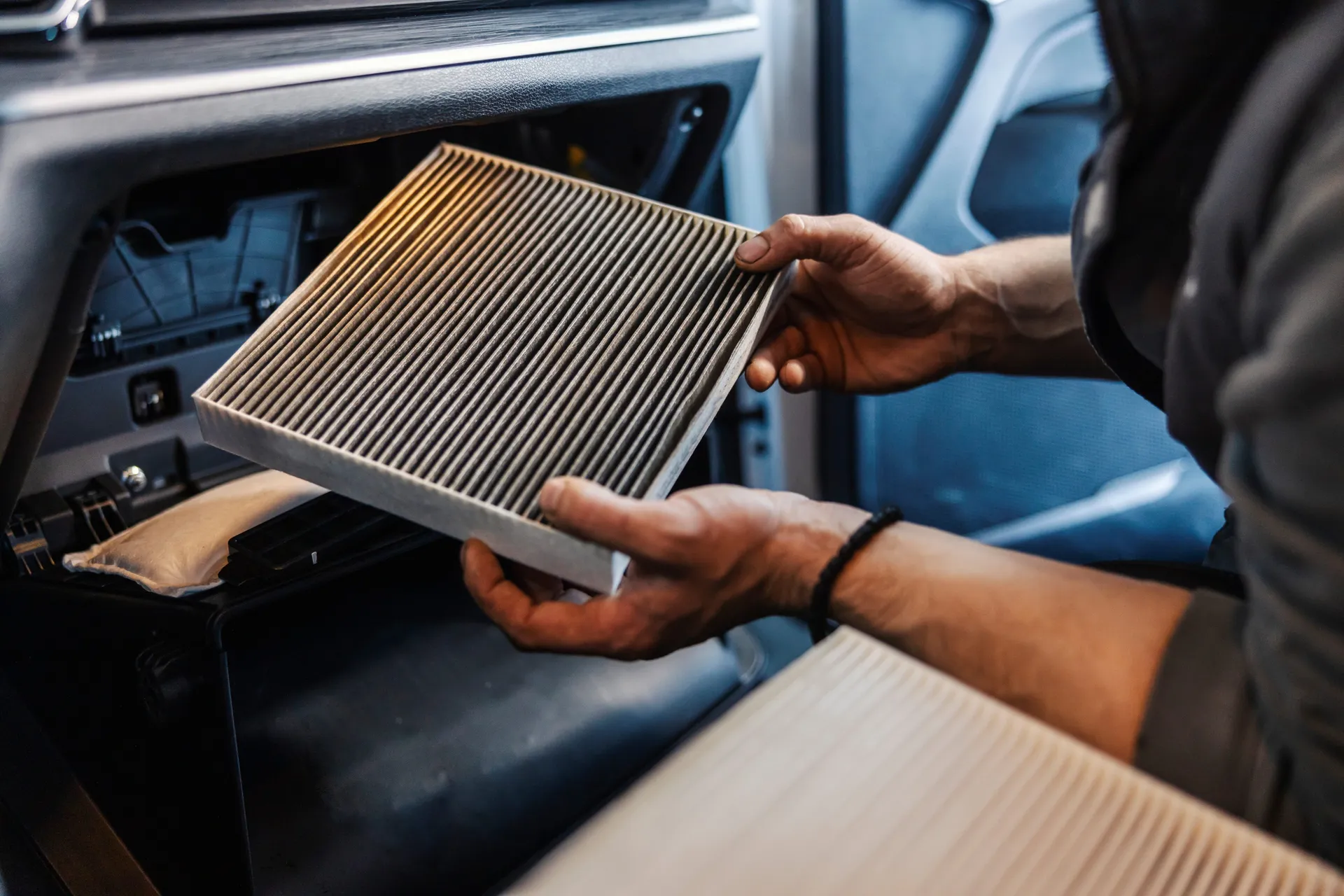 remove a clogged cabin air filter from the compartment