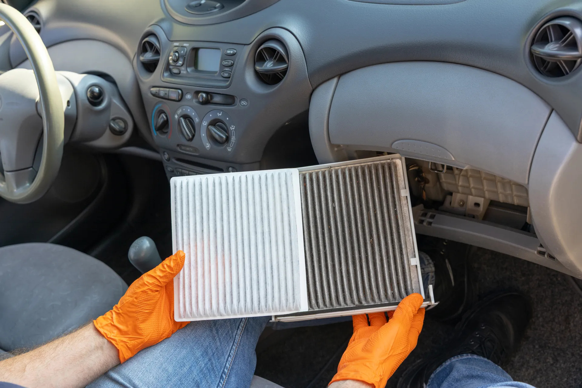 a dirty air filter near the glove box