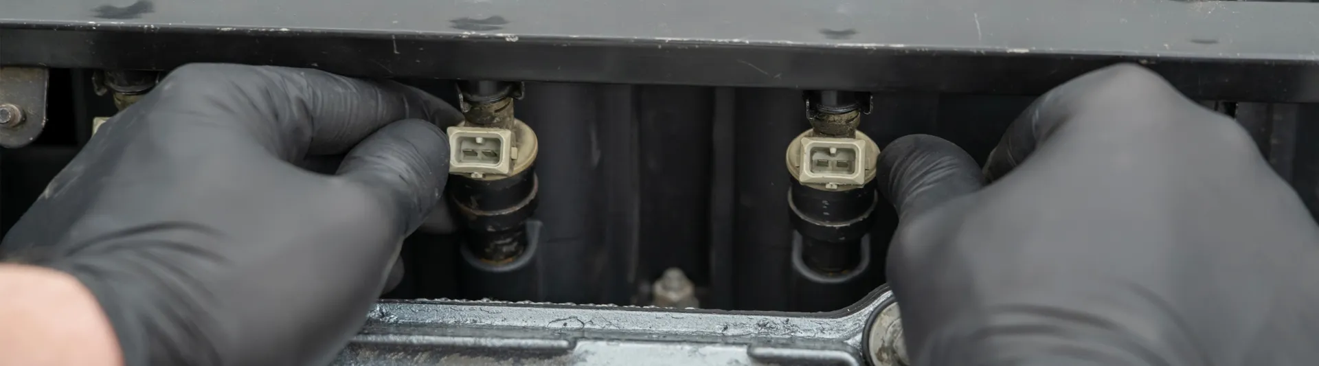 a-mechanic-hold-fuel-injectors