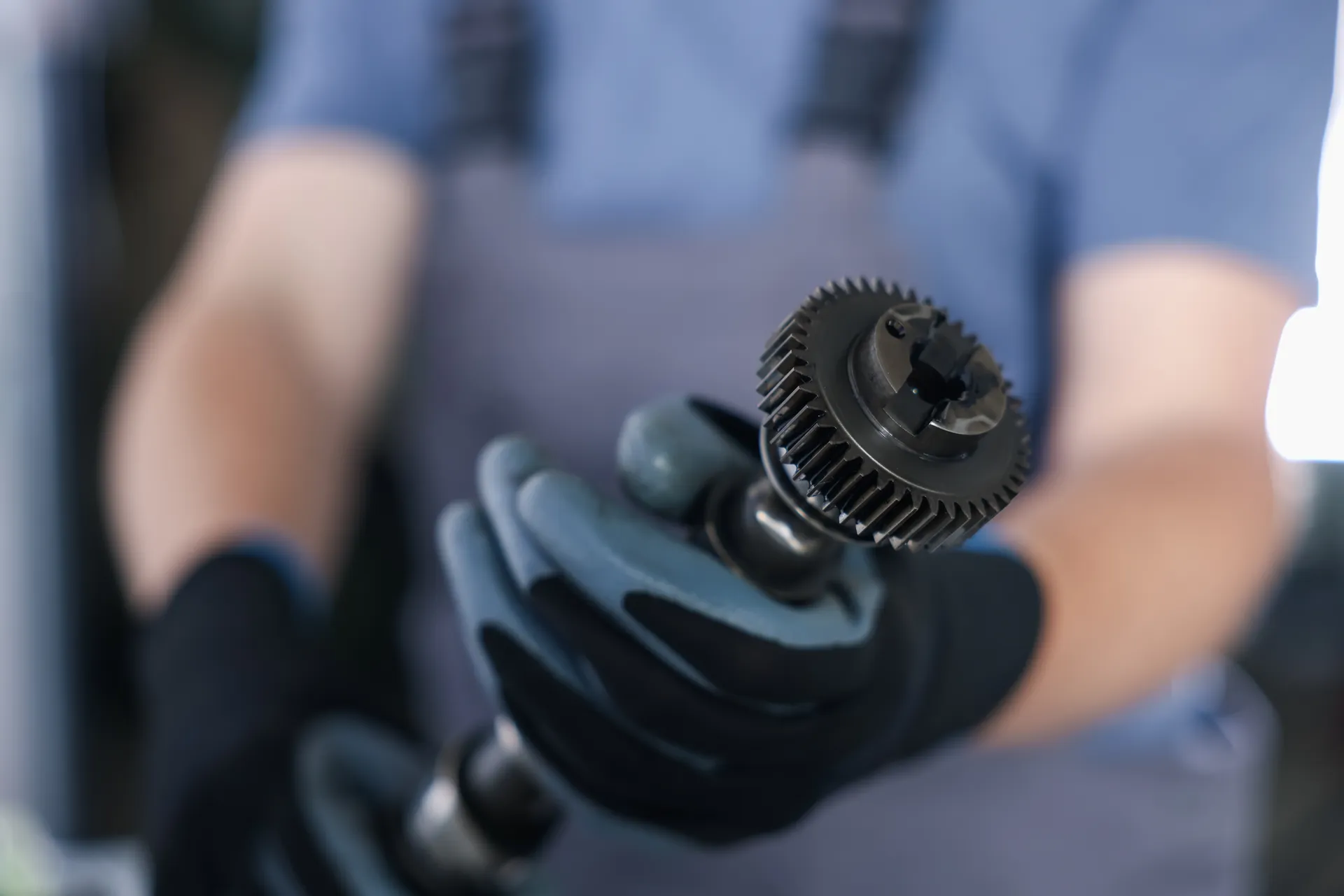 a person holds a crankshaft